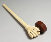A GOOD 19TH CENTURY CHINESE CARVED AND TURNED IVORY OPIUM PIPE, carved as a hand with bronze