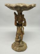A LARGE CARVED WOOD SHELL AND CUPID STAND, 3ft 6ins long.