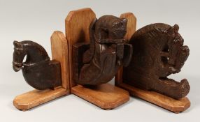 THREE CARVED WOOD MOUNTED HORSES' HEADS. 7.5ins (2) and 5.5ins.