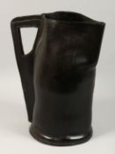 A GOOD LARGE LEATHER BOMBARD. 17ins high.