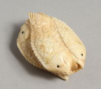 A CARVED BONE FISH NETSUKE, four fish