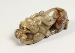 A CARVED JADE DOG OF FOU, 4ins long.