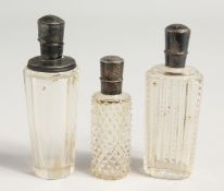 THREE SILVER TOP SCENT BOTTLE.