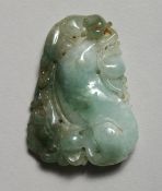A CHINESE CARVED JADE PENDANT 2ins x 1.25ins.