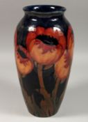 A LARGE MOORCROFT POPPY DESIGN VASE, script signature, 13ins high