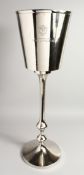 A BOLLINGER ICE BUCKET on a stand.