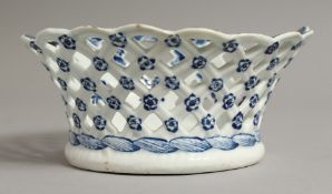 A BOW PIERCED BASKET painted with flowers.