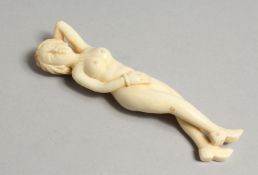 A CARVED BONE DOCTOR'S FIGURE. 4ins long.