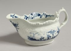 AN 18TH CENTURY CREAMBOAT painted in blue with Dark Sprig Centre, crescent mark.