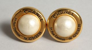 A PAIR OF GILT AND PEARL EAR CLIPS.