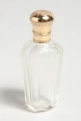 A GOLD TOP GLASS SCENT BOTTLE.