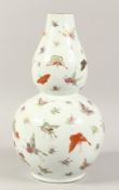 A CHINESE DOUBLE GOURD PORCELAIN VASE, the body painted with butterflies with four character mark to