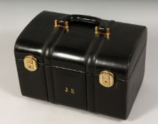 A GOOD LEATHER BEAUTY CASE with domed top and carrying handles, with initials J.S. 11.5ins long.