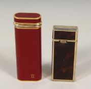 A CARTIER GAS LIGHTER, 2.75ins long, “41516V” and a HODSON LIGHTER, 2.25ins long (2).