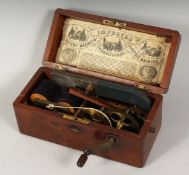 A MAGNETO in a mahogany box.