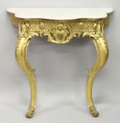 A 19TH CENTURY GILTWOOD CONSOLE TABLE, with grey veined serpentine white marble top, carved frieze