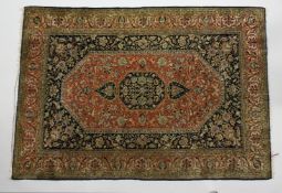 A PERSIAN DESIGN PART SILK RUG, black and pink ground with all over floral decoration. 5ft x 3ft
