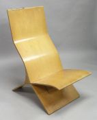 IN THE MANNER OF ISIKON, a moulded plywood chair, formed in two parts.