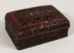 A 19TH CENTURY CINNABAR LACQUER RECTANGULAR BOX AND COVER the top with figures and buildings. 5.5ins