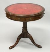 A SMALL GEORGE III STYLE MAHOGANY CIRCULAR SWIVEL TOP DRUM TABLE with inset leather top, two drawers