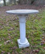 A WHITE CIRCULAR MARBLE TOP TABLE 1ft 7ins diameter x 2ft1ins high