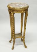 A 19TH CENTURY FRENCH GILTWOOD CIRCULAR STAND with inset marble top, curving legs with cane inset.