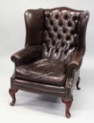 A GOOD GEORGE III DESIGN BROWN LEATHER, BUTTON UPHOLSTERED WING ARMCHAIR, on cabriole legs.