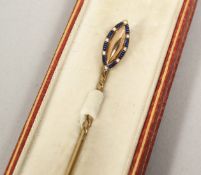 A GOOD ENAMEL TIE PIN, cased, Goldsmith & Silversmith Co.