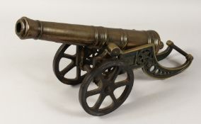 A BRONZE CANNON on a stand. Barrel 16.5ins long.