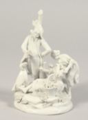 A GOOD BLANC DE CHINE GROUP OF THREE FIGURES, a man holding a rose, a woman with a basket of flowers