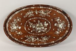 A CHINESE OVAL ROSEWOOD TRAY inlaid with mother of pearl. 24ins x 15ins