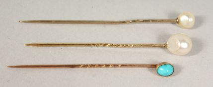 THREE PEARL TIE PINS, cased.