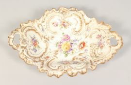 A DRESDEN PORCELAIN TWO HANDLED OVAL DISH with gilt decoration and painted with flowers. 13ins