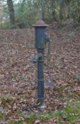 A BLACK PAINTED CAST IRON WATER PUMP 4ft 10ins long.