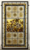 A VICTORIAN FRAMED STAINED/PAINTED GLASS FLORAL WINDOW. originally from the front door of a