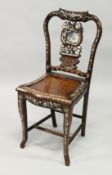 A CHINESE ROSEWOOD AND MOTHER OF PEARL SINGLE CHAIR with solid seat.