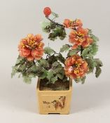 A CHINESE JADE FLOWER in a porcelain pot. 14ins high.