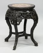 A 19TH CENTURY CHINESE ROSEWOOD AND MARBLE INSET CIRCULAR URN STAND,with pierced and carved apron,