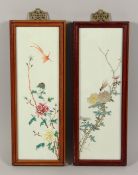 A GOOD PAIR OF FAMILLE ROSE LONG PORCELAIN PANELS painted with birds and flowers. 14ins x 5ins.