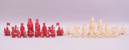 A VERY GOOD 19TH CENTURY CARVED AND STAINED IVORY PART CHESS SET, the kings and queens not matching,
