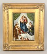 A FRAMED PORCELAIN PLAQUE. Madonna and child. 12ins x 9ins.