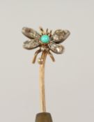 A DIAMOND SET BUTTERFLY TIE PIN, cased.