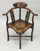 A CHINESE ROSEWOOD AND MOTHER OF PEARL CORNER CHAIR with solid seat.