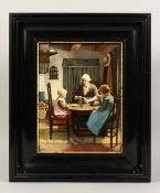 ROZENBURG A FRAMED PORCELAIN PLAQUE, mother and children sitting at a table having tea. Signed