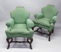 A PAIR OF EARLY 20TH CENTURY UPHOLSTERED, WALNUT FRAME SMALL ARMCHAIRS, with shaped backs and