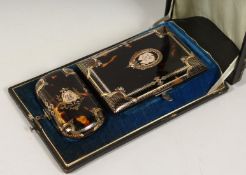 A GOOD VICTORIAN TORTOISESHELL INLAID PURSE AND CARD CASE in a leather case.