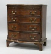 A GEORGE III STYLE MAHOGANY SERPENTINE FRONT CHEST OF DRAWERS, with brushing slide and four
