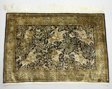 AN INDIAN PART SILK HUNTING DESIGN RUG. 3ft 8ins x 5ft 4ins