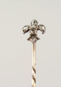 A DIAMOND FLEUR-DE-LIS TIE PIN, cased.