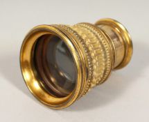 AN OPERA GLASS, Abrahams Opticians, Bath. 3.5ins diameter.